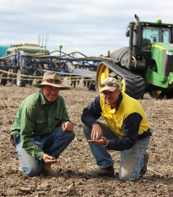 Waiting: Westmar farmer Phillip Coggan with employee Jason Spendelove during planting at Enarra last Thursday. Since then Enarra has recieved 23 to 32mm. 