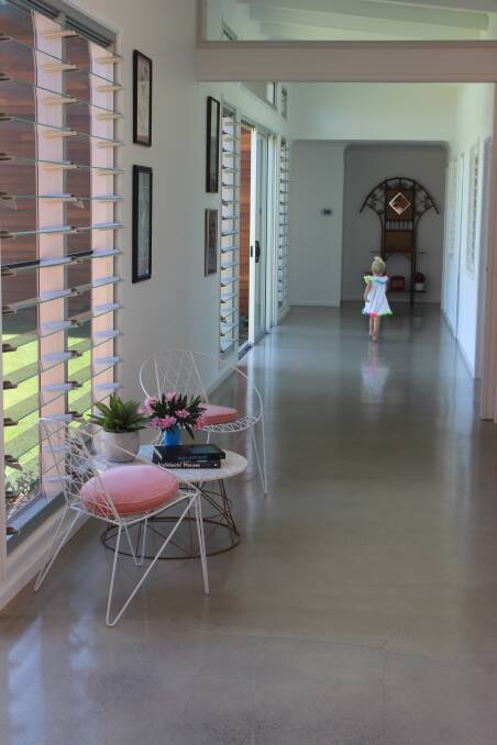 The 2.2m wide polished concrete hallway also doubles as a sunroom or playroom for the kids. 