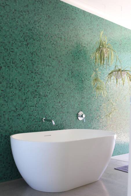The main ensuite features a beautiful mosaic wall.