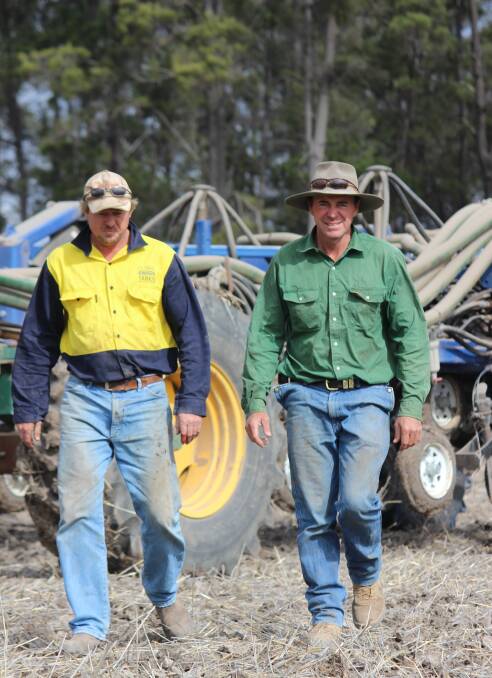Westmar graingrower Phillip Coggan with employee Jason Spendelove during planting at Enarra last Thursday.