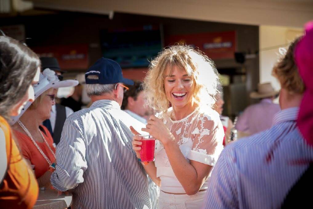 Having a ball at the Roma Picnic Races last year. 