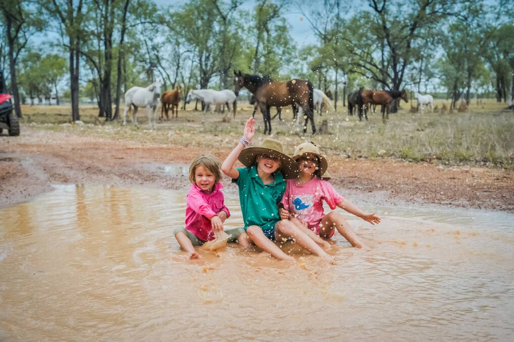 Emilee, Hayley and Clare O'Sullivan were enjoying some rare time in puddles at Jumba Station near Charters Towers on Saturday. The property received 45mm in total. 