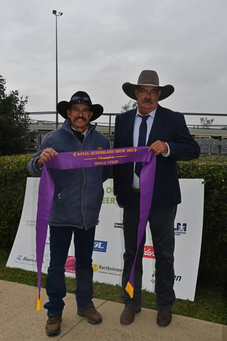 Neil Goetsch accepts the grand champion single steer ribbon from Competition judge Matthew Noakes, Bottletree, South Mornish on behalf of his son Bill. Picture: Billy Jupp 