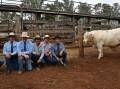 Selling agents, James Bredhauer, Midge Thompson and Corey Evans, Aussie Land and Livestock, Kingaroy, buyers Ashley and Brayden Trigger, Biggenden and Charnelle Charolais stud principal Graham Blanch with the top selling bull. Picture: Billy Jupp