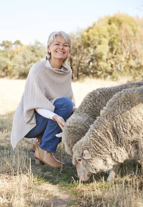 Model Charlotta Thaarup-Owen with Merino sheep in the photo shoot for the Natural for birds collection.