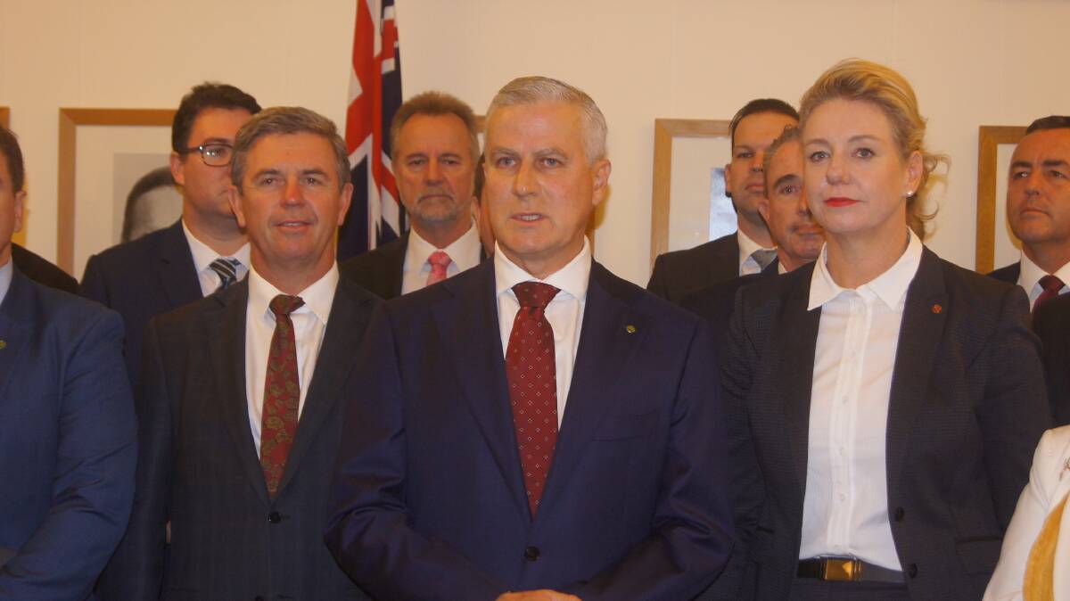 Nationals leader Michael McCormack (centre) speaking to media in Canberra.