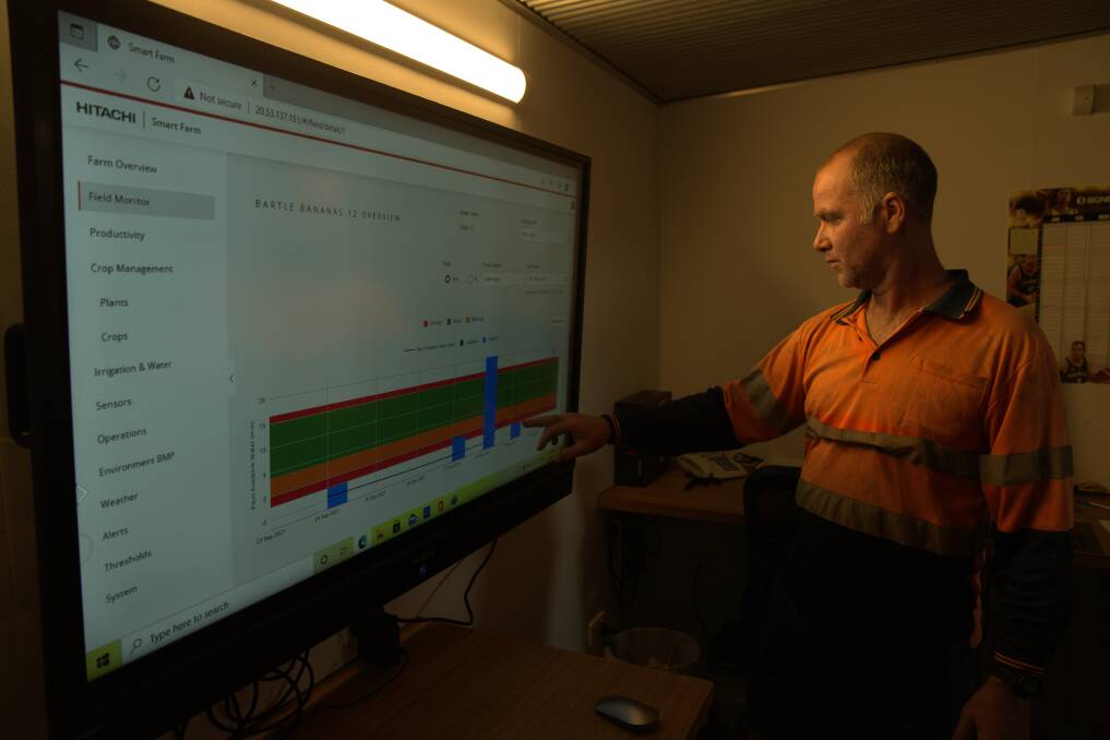Gavin Devaney, Bartle Frere Bananas, Boogan checks a screen providing a visual representation of on-farm sensor and tracker data, helping him make better environmental and efficient decisions. Picture supplied. 