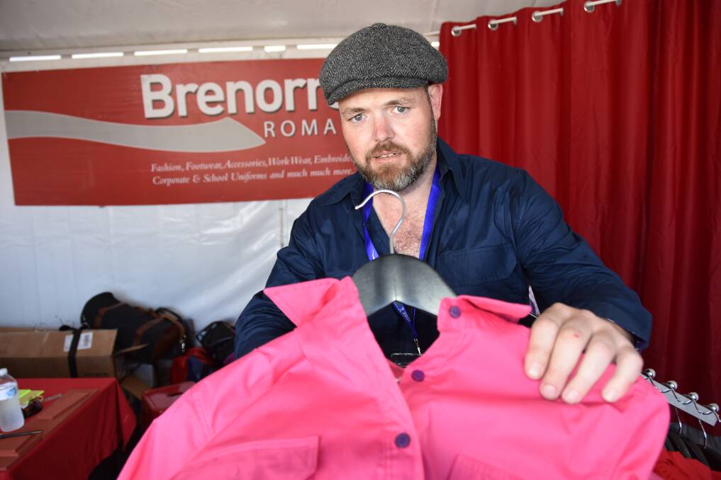 GIVING: Nathan Garvie, Brenorrs, Roma with one of the newly launched Epicool work shirts at Beef 2021. Five dollars from the sale of every shirt goes to Epilepsy Queensland. 