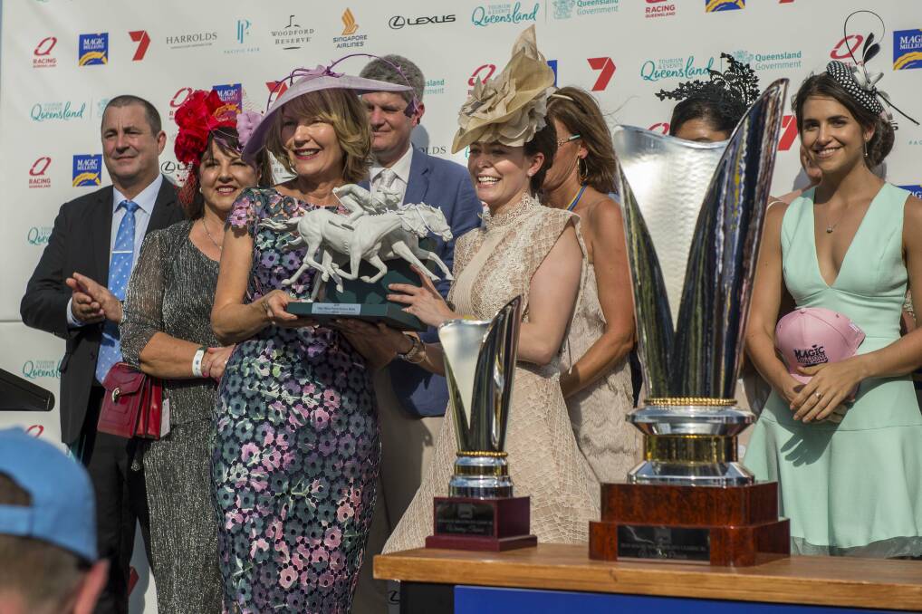 Magic Millions co-owner Katie Page-Harvey (third left) presents the Magic Millions Racing Women trophy to Qatar Racing assistant racing manager Hannah Wall and and connections of Sunlight in January. Picture - Magic Millions
