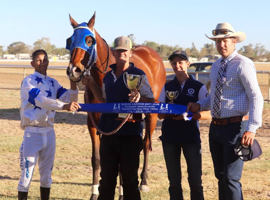 Winner of the Strathmore Blackall Cup Fabs Cowboy with (from left): Jockey Paul Randall, Toowoomba, Fabs Cowboy, strappers Dale Ward and Marie Marsaa, Miles, and sponsor Ben Walker, Strathmore Santa Gertrudis Stud, Blackall. 