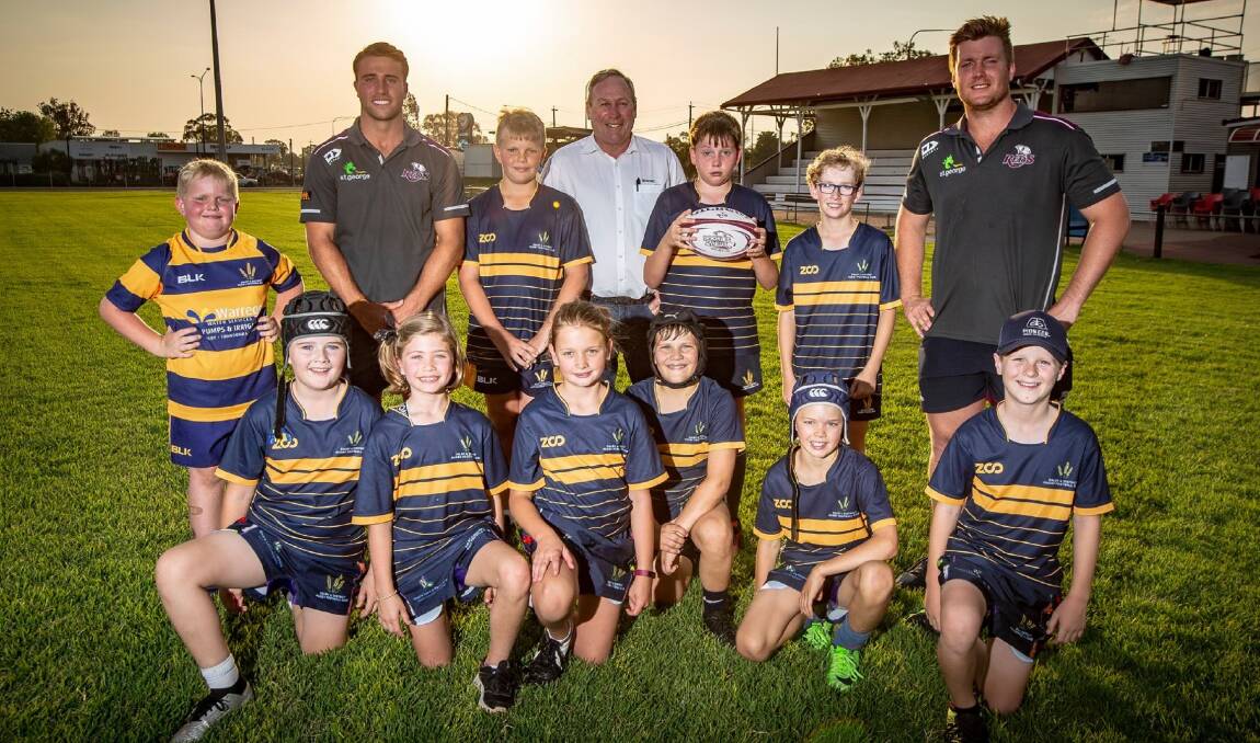 St George Queensland Reds players Harry Hoopert and Hamish Stewart, with Western Downs Regional Council Mayor Paul McVeigh and Dalby Wheatmen players during the recent Reds to Regions tour.