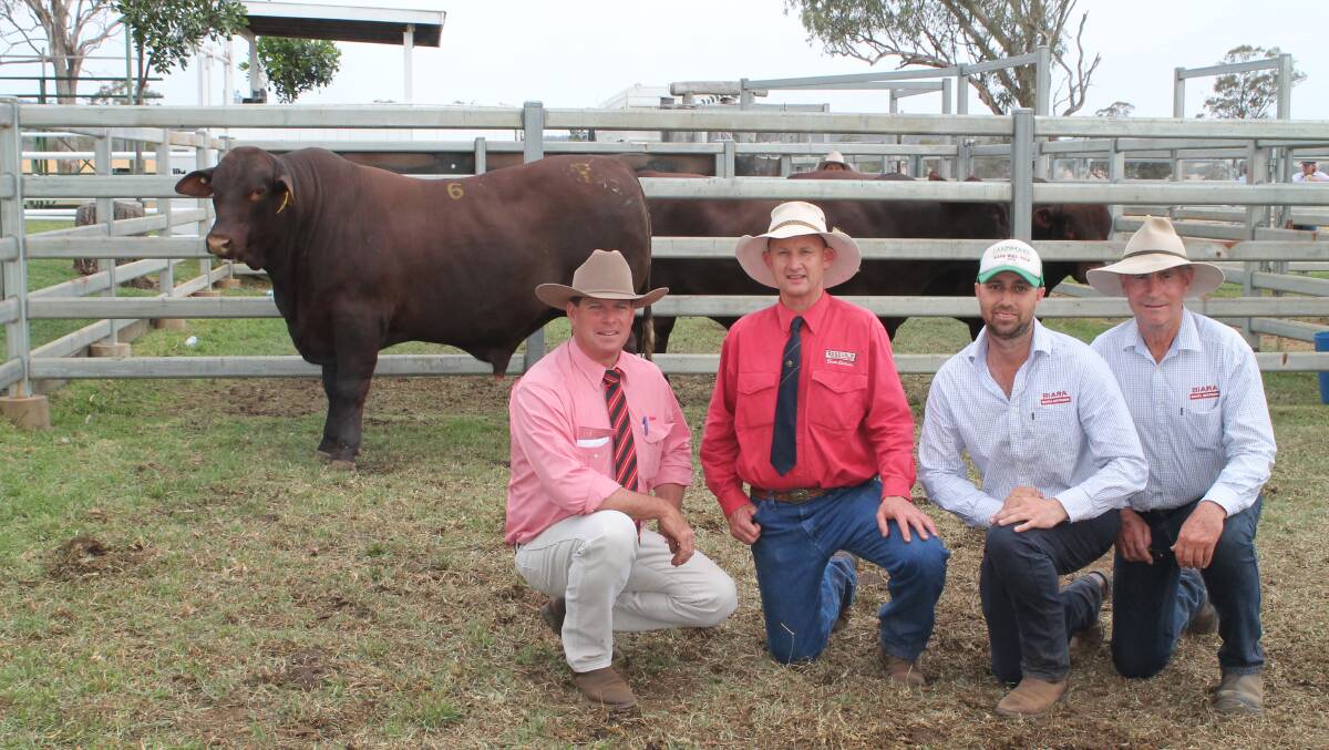 Auctioneer Michael Smith, Rosevale co-principal David Greenup and buyers Glenn and John Hasleby with their $42,000 Rosevale Monty M482 (PP).