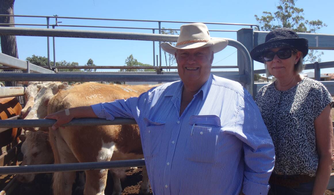 Noel and Liz Cook, Kindon Station, Goondiwindi, with a pen of Simmental steers that sold for$1640 at Toogoolawah on Friday.