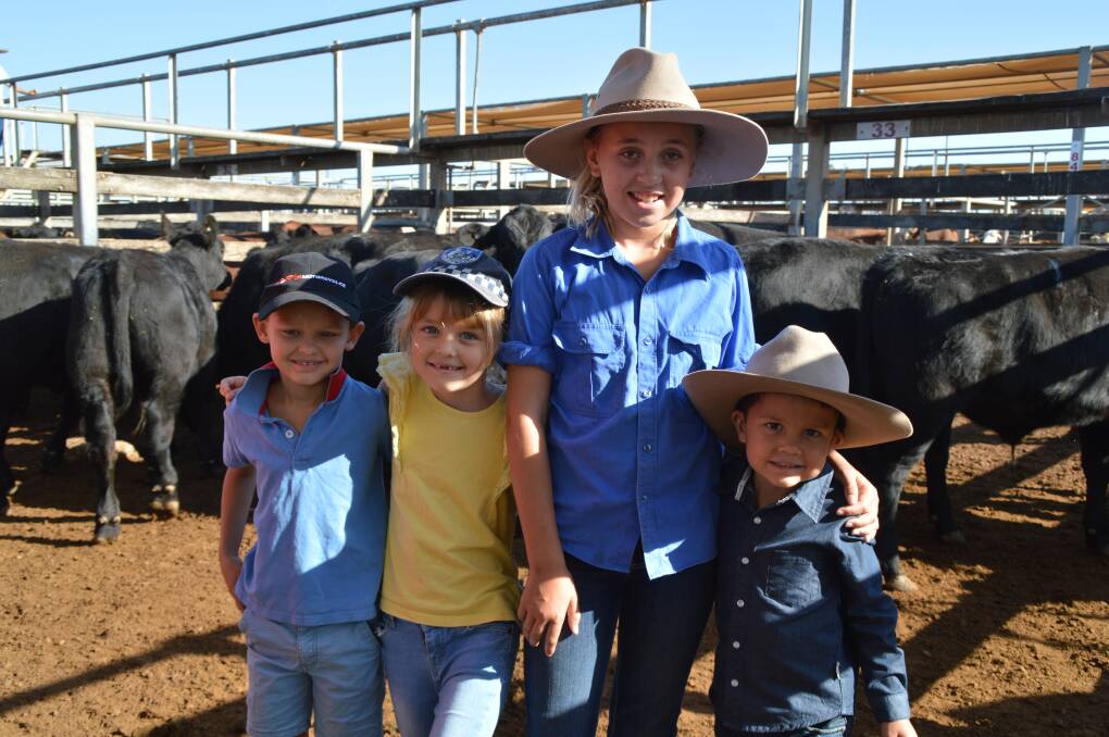 Siblings Hugh, Addie and Flynn White caught up with Heidi Dodd (third from left) for a day out at the Roma Saleyards on Tuesday. 