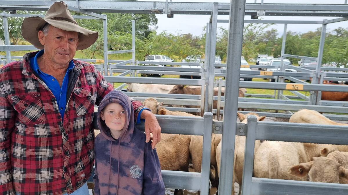 John Wyatt, pictured with grandson Sonny Finch, sold Charbray weaner steers for $1390.