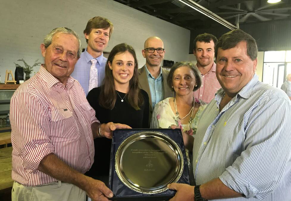 CELEBRATING 70 YEARS: Richard, Annabel, Diana and Ian Locke, with a commemorative plate from RaboBank's Ivan Lilley and Murray Wallace, at rear with Jack Hanna.
