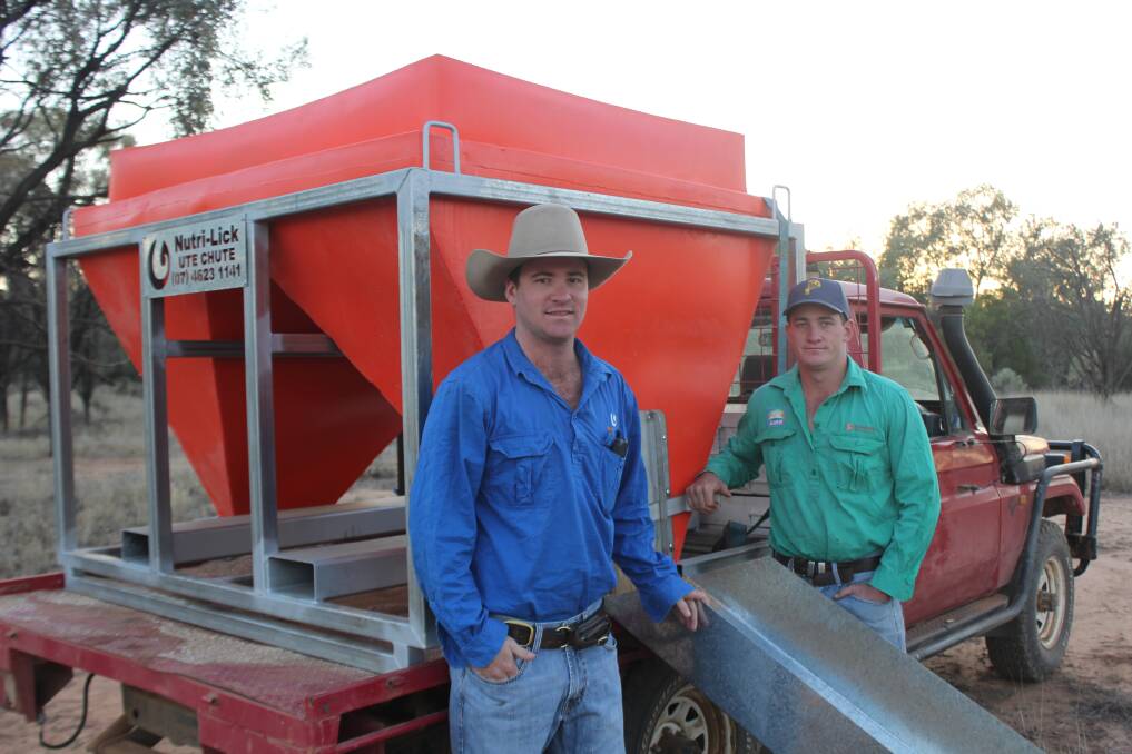 KEEPING UP WITH THE JONESES: Queensland brothers Jack and Will Jones with one of the Ute Chutes they designed and are building for customers to more easily handle the dry lick produced in their family's Nutri-Lick factory at Mitchell. 