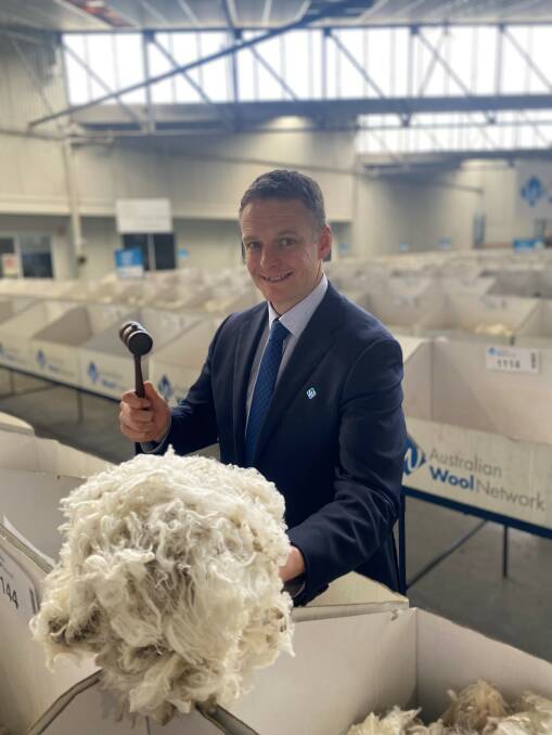 AWN Victorian wool manager Kelvin Shelley with one of the top priced lines sold recently. 