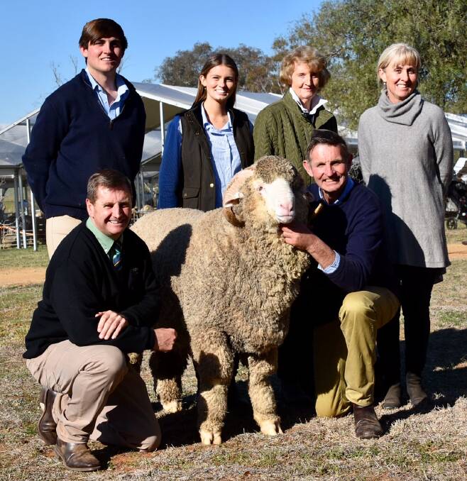 GAME CHANGER: The Yarrawonga ram that sold for $60,000 in a private sale to a three-way syndicate. Pictured from left to right is Rick Power of Landmark stud stock, Grenfell, who brokered the deal and Sam, Georgie, Thea, Liz and Steve Phillips, all of Yarrawonga stud, Harden. 