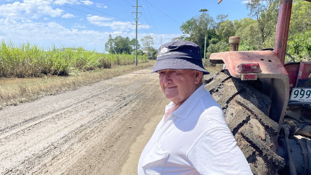 NSW Sugar Milling Co-operative chairman Jim Sneesby surveys mud debris and two year old cane near Broadwater.