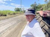 NSW Sugar Milling Co-operative chairman Jim Sneesby surveys mud debris and two year old cane near Broadwater.
