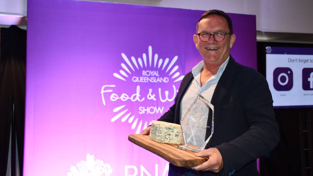 Peter Cross from Calendar Cheese Co accepting the Grand Champion Dairy award on behalf of Berrys Creek Gourmet Cheese. 