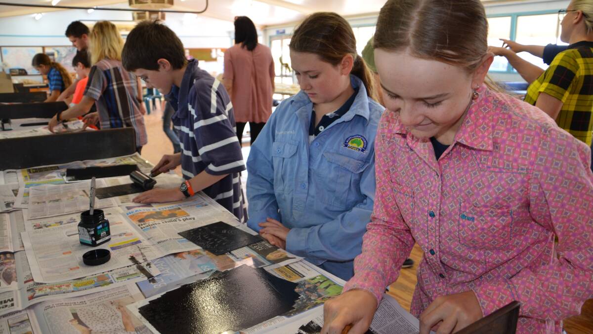 Western Alliance students work on their printing skills during an art workshop. 