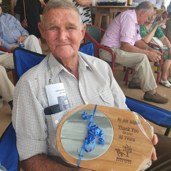 Country racing stalwart Jim Allpass holds the plaque thanking him for more than five decades of service to the sport. 