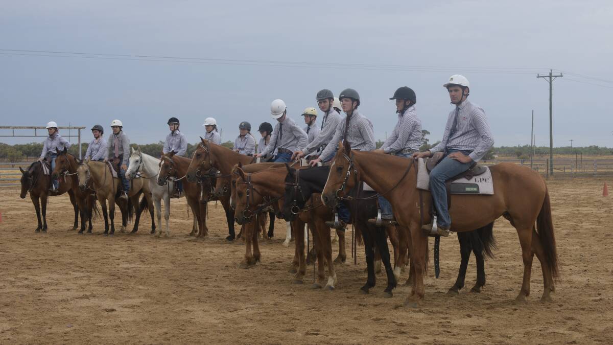 Longreach Pastoral College students prepare for the Stockman's Challenge ahead of graduation later that night. 
