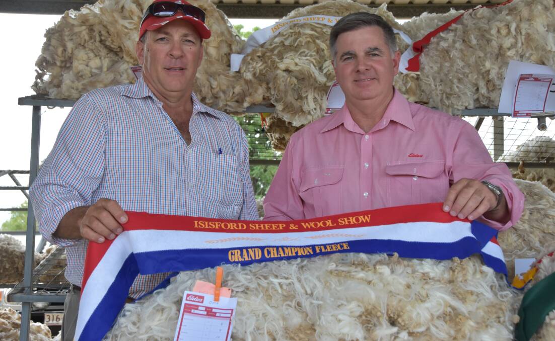 Will Chandler and Bruce McLeish with the Grand Champion fleece at the Isisford Sheep and Wool Show. 