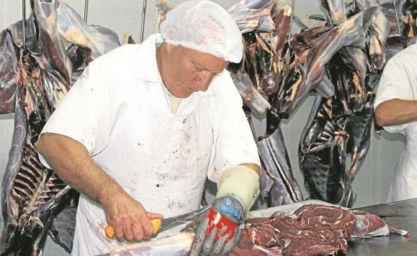 A kangaroo carcass is harvested at Waroo Game Meats in Surat. 