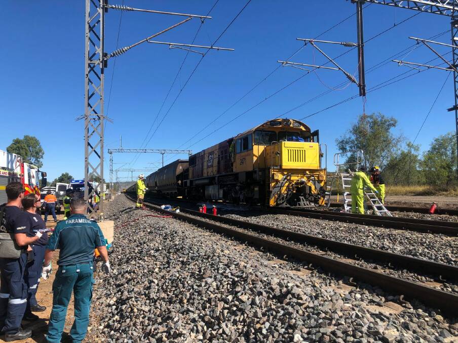 A coal train collided with a stationary train wagon near Westwood late Friday morning. Picture: RACQ CapRescue 