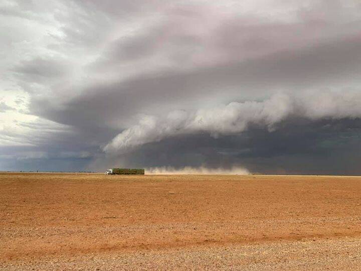 CAT AND MOUSE: An afternoon thunderstorm chasing a Road train, 5km South-East of Boulia on Tuesday. Photo: Rick Britton