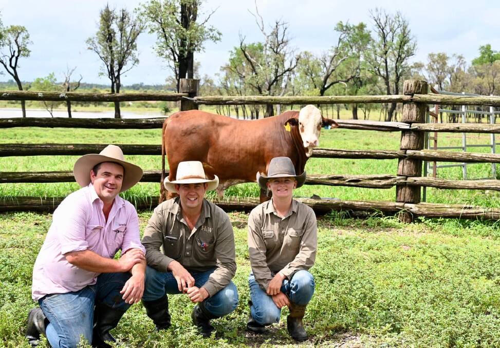 SALE TOPPER: Top price bull Bendemeer BEN20R008, with vendor Doug Burnett, Bendemeer, Clermont, auctioneer Jake Passfield, Hoch and Wilkinson Livestock and Property, and Dana Anderson, representing purchaser Frankfield Pastoral Company. Pictures: Olivia Marks 