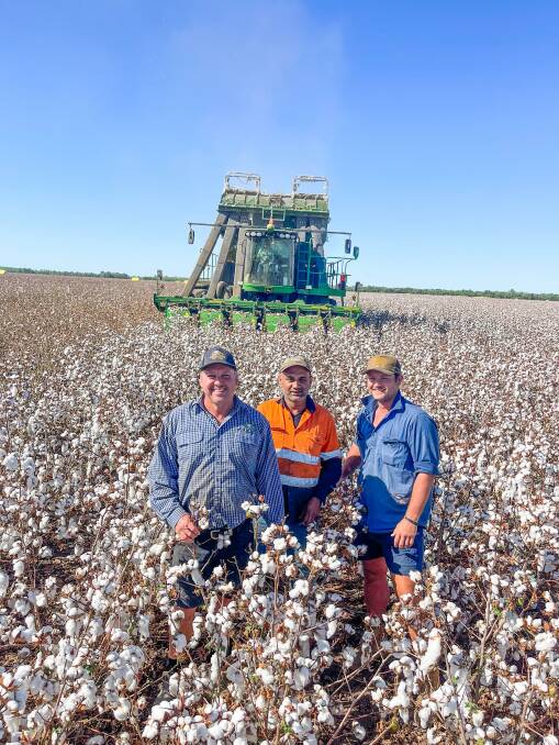NRG Ag farm staff manager Craig Barsby, and workers George Egum, and McLayne Black, in a paddock of cotton being picked from the Morawitz family's property, west of Comet. Photo: Ben Harden