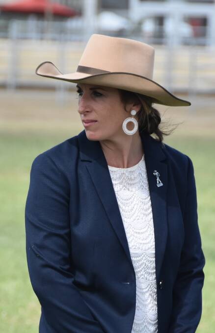 Champion competition over-judge Kim Groner, Elite Cattle Company, Meandarra, has a watchful eye on the competitors' parading skills during the champion round. Picture: Ben Harden