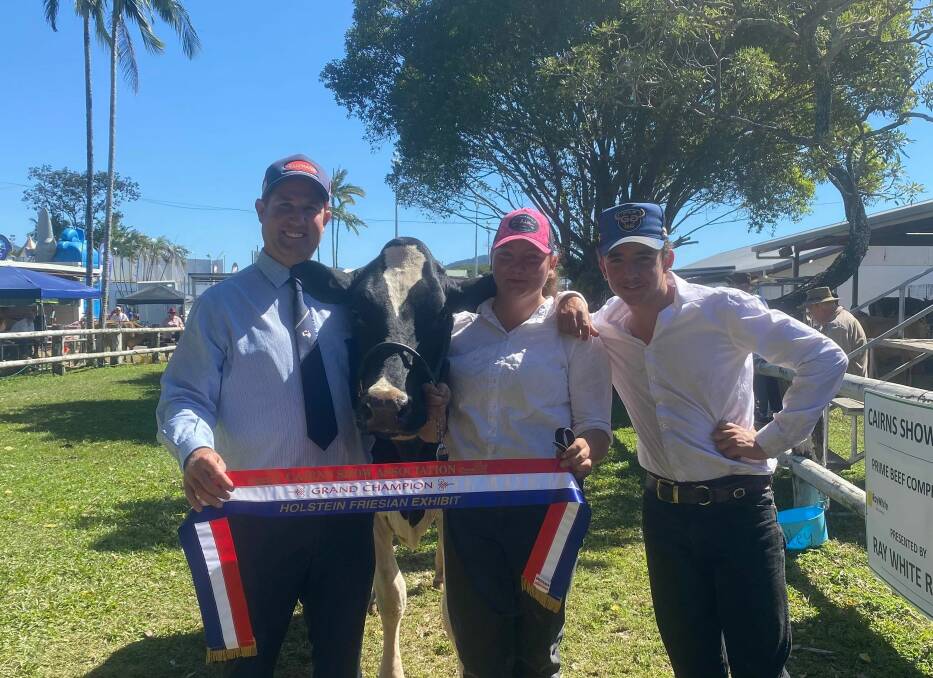 Grand champion Holstein Friesian, Millaaview Bursting Pansy, with judge Steven Ledger, and exhibitors Terese and Matthew Daley. 