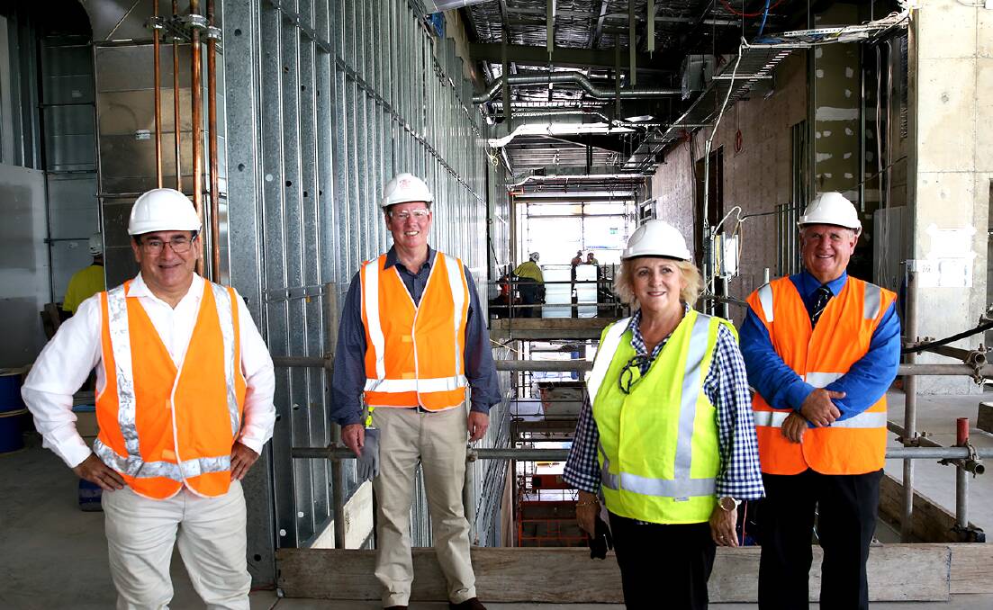 MAJOR MILESTONE: Rockhampton Councilor Drew Wickerson, Local member Barry O'Rourke, Federal member Michelle Landry and Acting Mayor Neil Fisher inspect the Rockhampton Art Museum after it entered the lock up stage. Photo: 