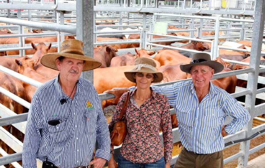 Livestock agent Greg Hardgrave, CRT Country Co, Blackwater, with Trudy and Bruce Roberts of Callistemon Cattle Co, Springsure, pictured back in mid 2022 at the Emerald saleyards, with their pen of Santa x Angus cross heifers which sold for $2620 per head. Picture: Ben Harden