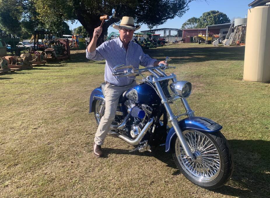 Auction Centre Bundaberg auctioneer Bill Young, with the custom-built 2007 Super Glide 1690cc 103ci Harley Davidson bike. Picture: Supplied 