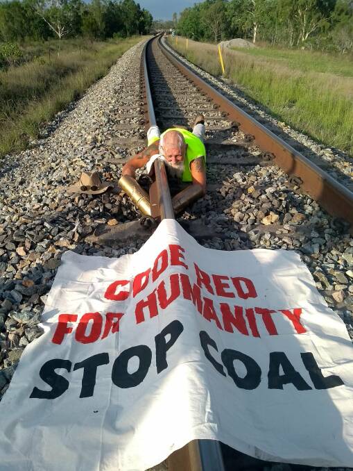 'Frontline Action on Coal' activist locked to the tracks of the Newlands rail line in Central Queensland on Wednesday. Picture: Frontline Action on Coal