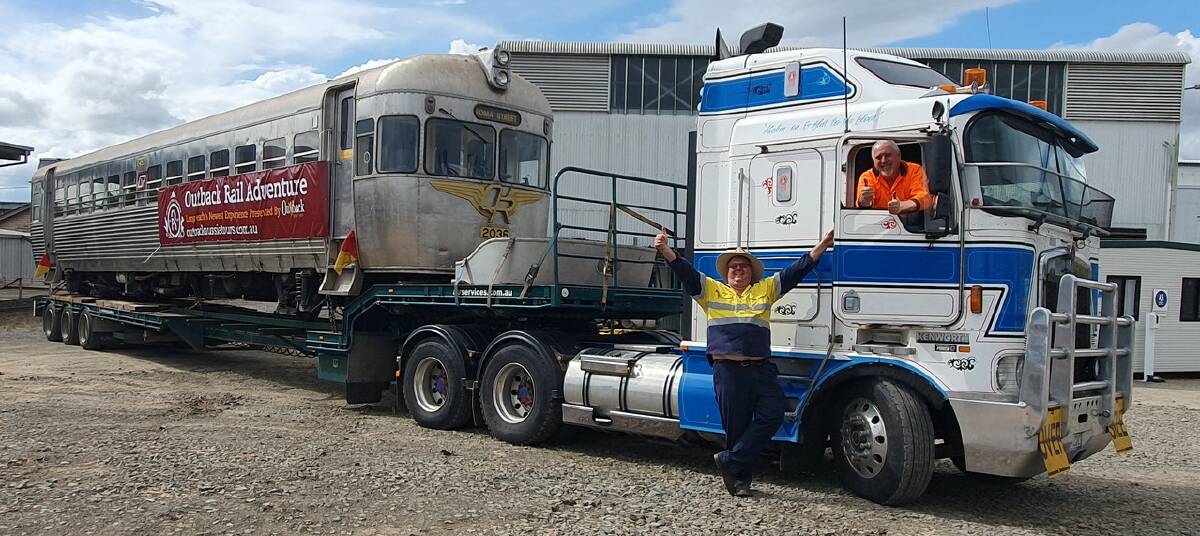 Outback Aussie Tours owner Alan Smith and driver Mario Mencigar, Australian Train and Railway Services, oversee the transportation of the 22t 2000 class rail motor bullet trains, which departed Ipswich this week. Picture supplied by Outback Aussie Tours 