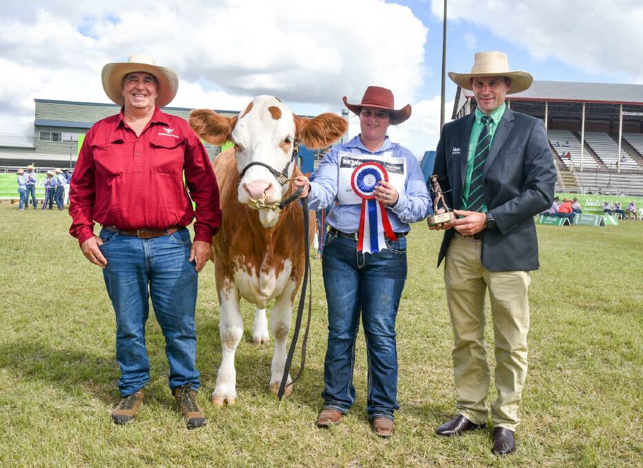 Grand champion female, Wondenia-Denmire Treasure, exhibited by Max Dench and family of Country Sand & Concrete Pty Ltd, Wondenia-Denmire Fleckvieh stud, Gilgandra, NSW, pictured here with handler Aubrey Svensen, Rob Bygrave (left), Eidsvold Livestock, and Nutrien Ag Solution's Al Tippett. Picture: Ben Harden 