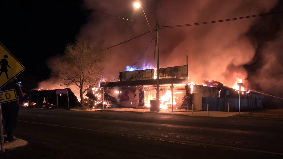 DEVASTATING BLAZE: A fire destroyed Mungindi's only supermarket, butcher shop and a clothing store on Tuesday night. Photo: Sam Heagney, Twitter