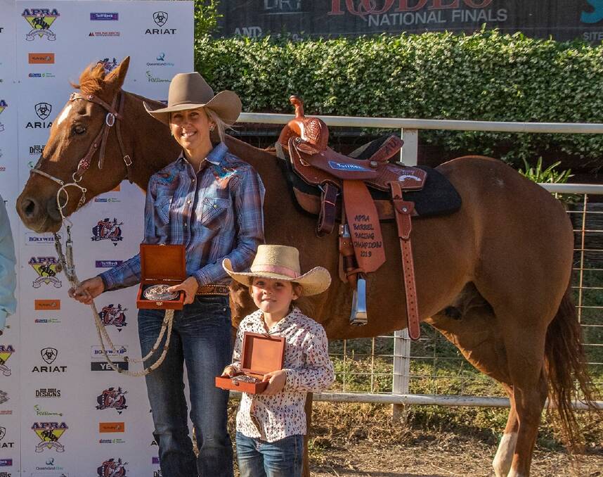 WINNER: Chantel Huddy won the 2019 Barrel Racing Champion, Aggregate Champion and Pro Tour Champion. Pictured with daughter Clara and horse Mick. Photo: Framed Forever Fotos.