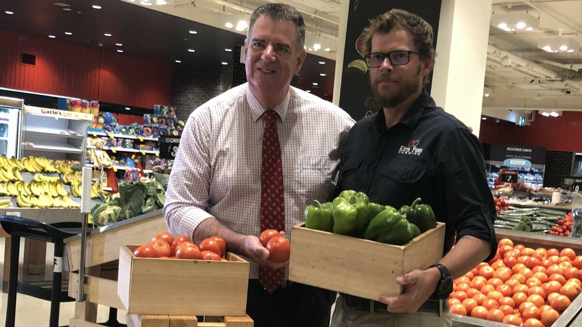 Agriculture minister Mark Furner with Stanthorpe grower Tim Carnell. 