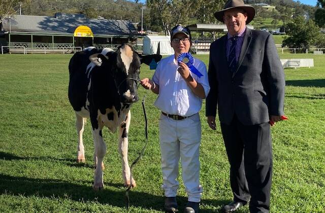 12 years and under 15 years winner Hunter Barron with dairy chairman Wayne Bradshaw.