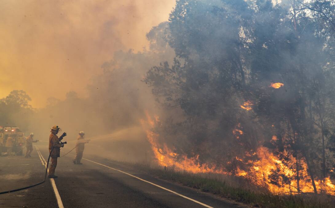 Firefighters battle a blaze at Noosa. Photo - QFES. 