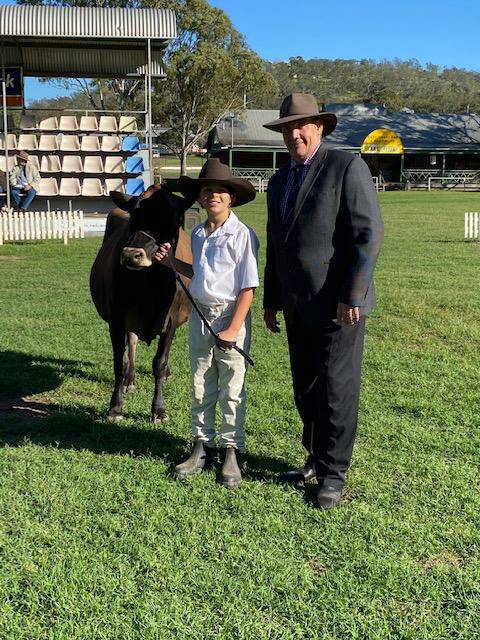 Under 12 years young parader winner Ayce Barron with dairy chairman Wayne Bradshaw. 