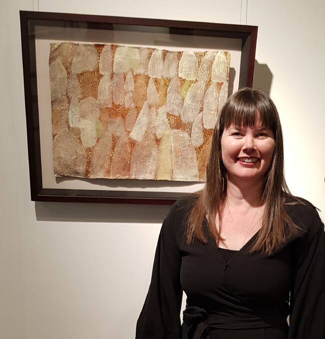 Winton artist Karen Stephens with her artwork Mitchell, Feathertop and Flinders, which she won the Queensland Regional Art Awards' Remote Artist Award for in 2018.